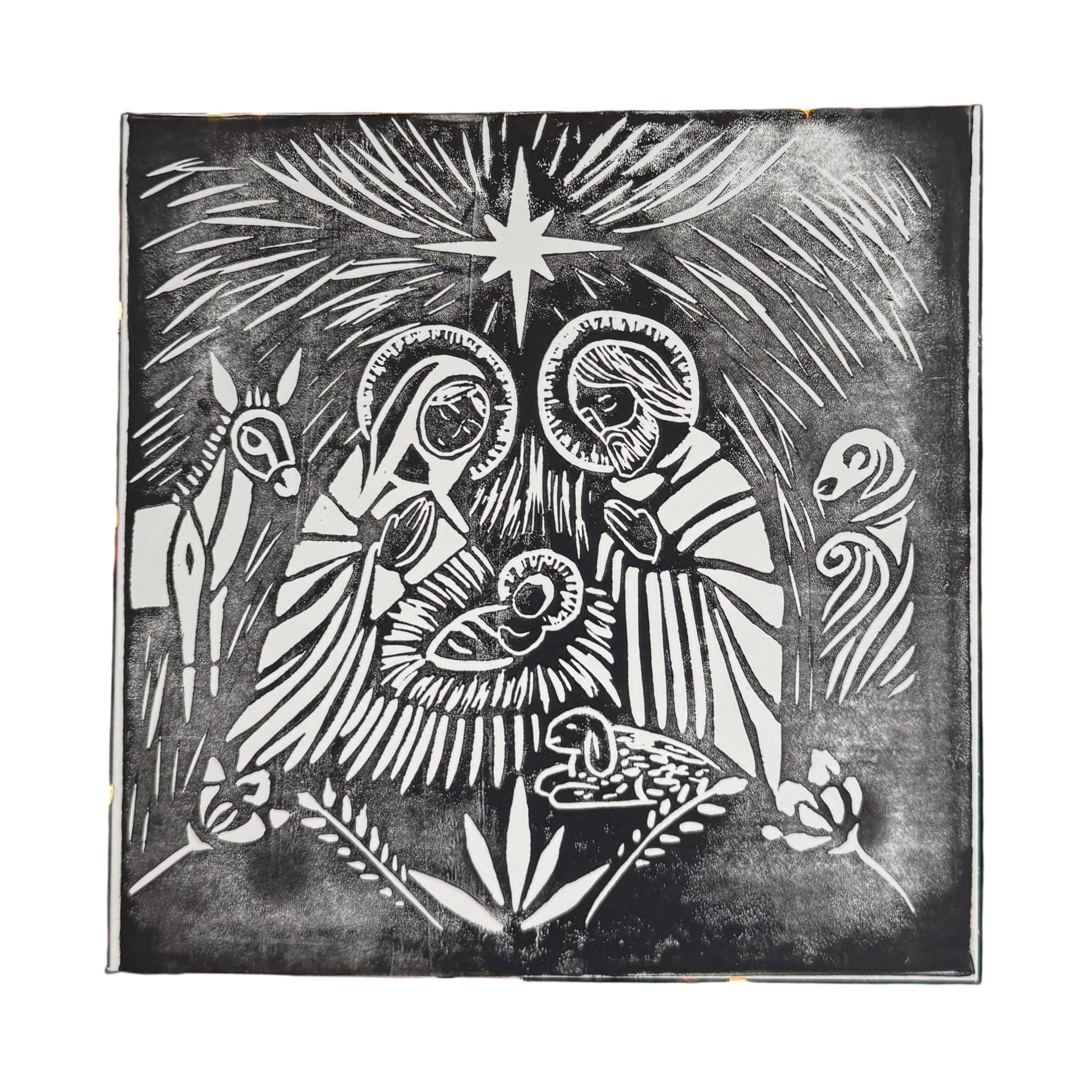 Handgemachte Linoldruck-Weihnachtskarte mit klassischer Krippenszene: Maria, Josef und das Jesuskind unter dem Stern von Bethlehem.